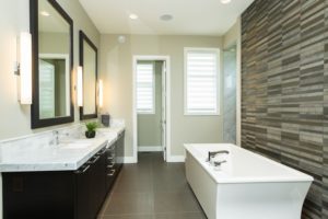 The Soho II – Ensuite – The free standing tub is backed on to an impressive 13’ x 4’ marble his/hers shower enclosure. Dark stained custom cabinets are contrasted by the Carrera marble 2 ½” countertop. A spacious walk in closet is located directly beside the ensuite for ease of accessibility.